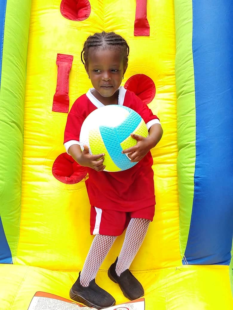 Young Zenith School pupil holding a ball