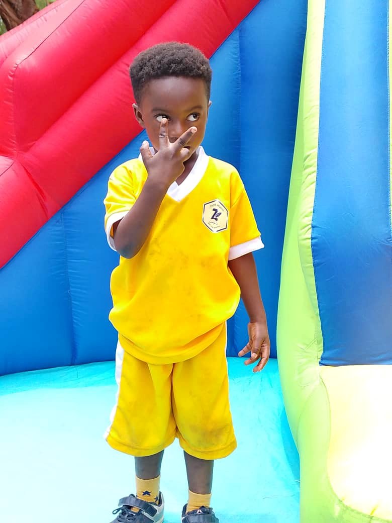 Young Zenith pupil in yellow sports uniform
